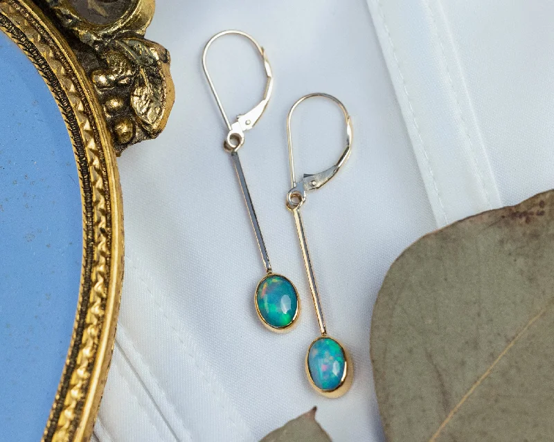 Java tile earrings-OVAL BEZEL SET ETHIOPIAN OPAL DROP EARRINGS IN 14K YELLOW GOLD