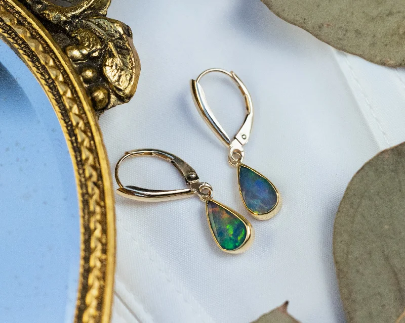 Aged coin earrings-TEARDROP BEZEL SET ETHIOPIAN OPAL EARRINGS IN 14K YELLOW GOLD