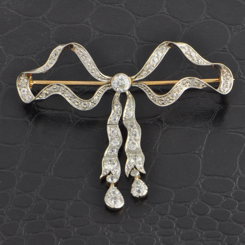 Sunflower motif brooches-Antique Edwardian Diamond Bow Brooch in 18k Yellow Gold and Platinum